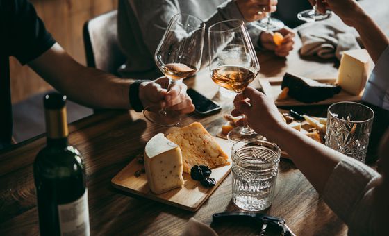 Group relaxing and socializing over wine and tapas in Poreč