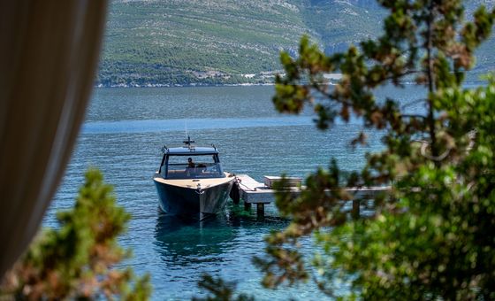 Luxury Colnago 35 speedboats moored and entering a small Adriatic harbor near Dubrovnik