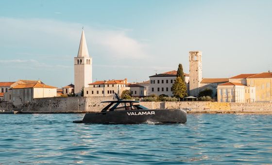 Private Colnago 45 yacht passing the historic waterfront of Poreč during a photo cruise.