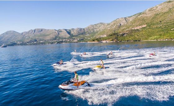 Group jet ski safari tour near Dubrovnik with multiple riders exploring the Adriatic coastline