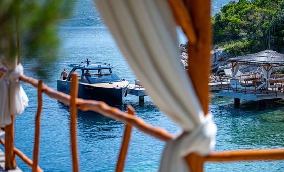 Luxury day boats gathering and docking in a scenic Dubrovnik island harbor