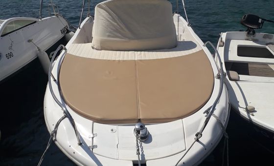 Front bow sun deck with cushions on a small motorboat available for rent in Croatia